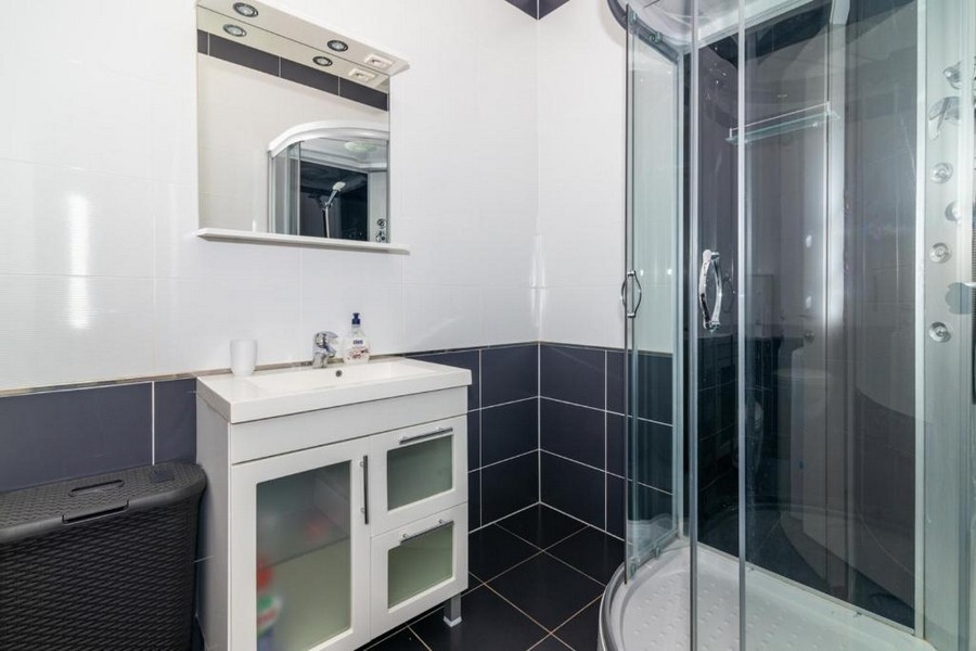 Bathroom with shower and glass shower cubicle