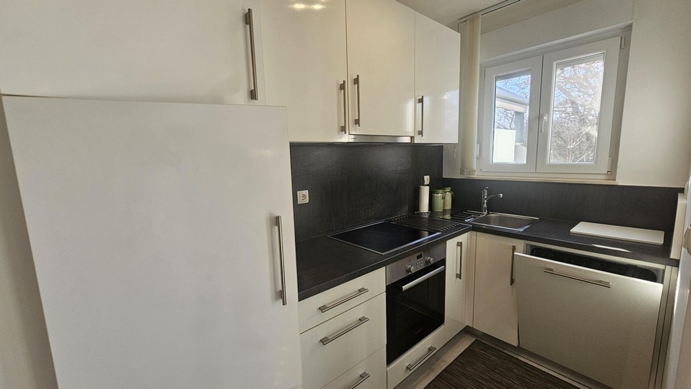 Modern fitted kitchen with window