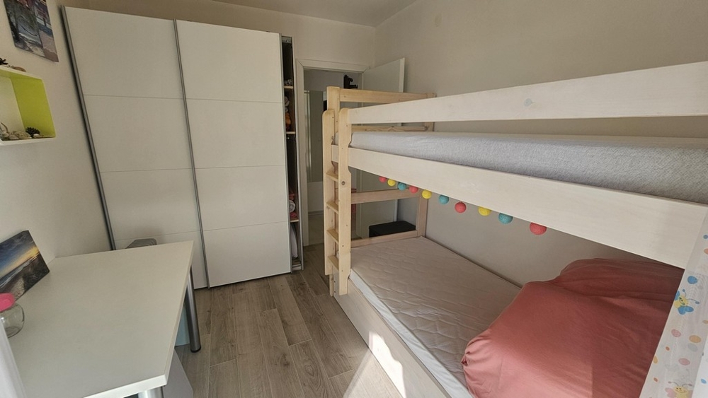 Children's room with bunk bed and wardrobe