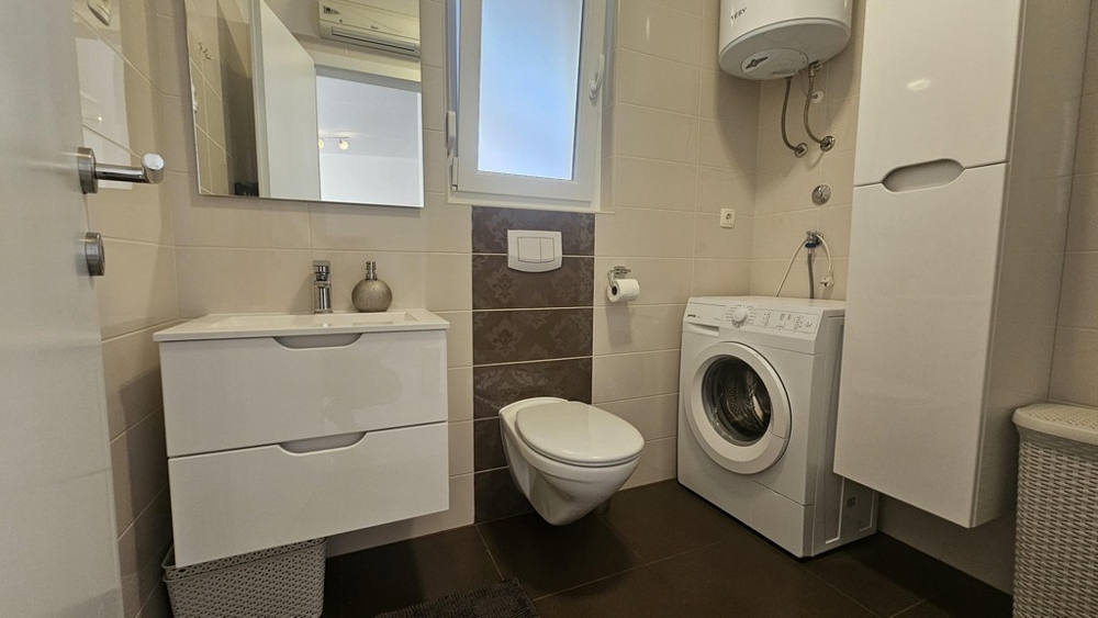 Modern bathroom with washing machine