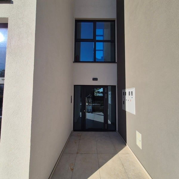 Entrance area of ​​the building with glass front