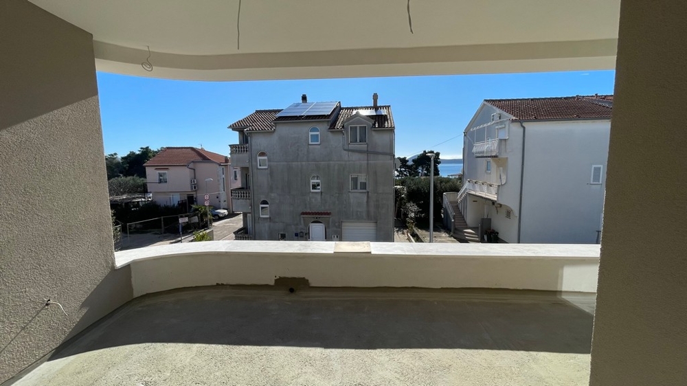 Terrace with a view of neighboring buildings and the sea