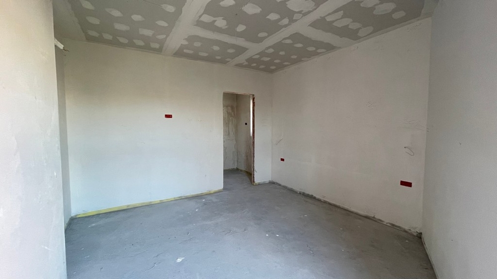 Unfinished bedroom with access to the hallway