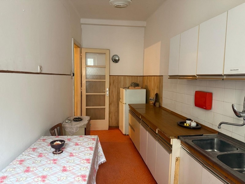 Kitchen with built-in unit and dining area