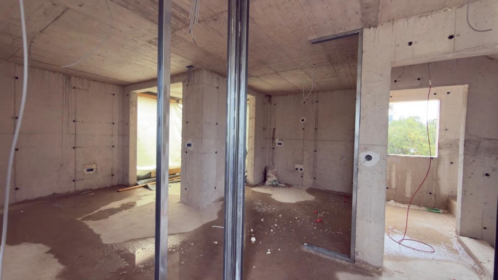 Open living area in the shell with window and sea view