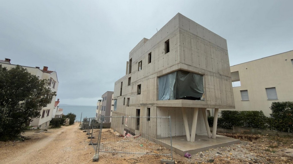 The ground floor apartment in this modern new building is for sale.