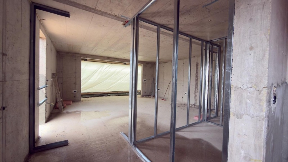 Open living area in the shell with a large window front