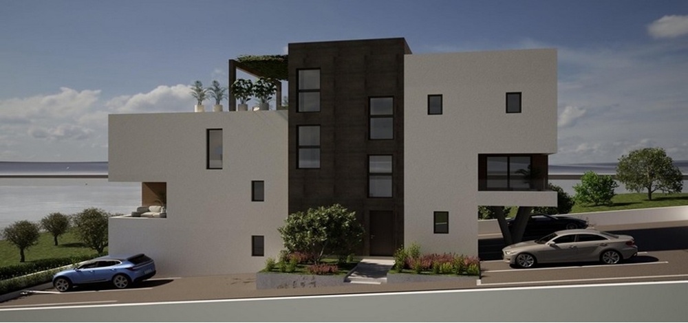 Street view of a modern new building with parking spaces