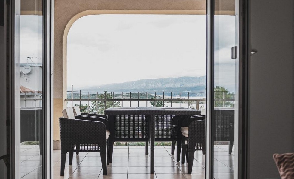 Covered terrace with sea views and seating area