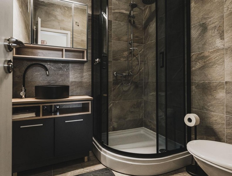 Bathroom with shower and vanity