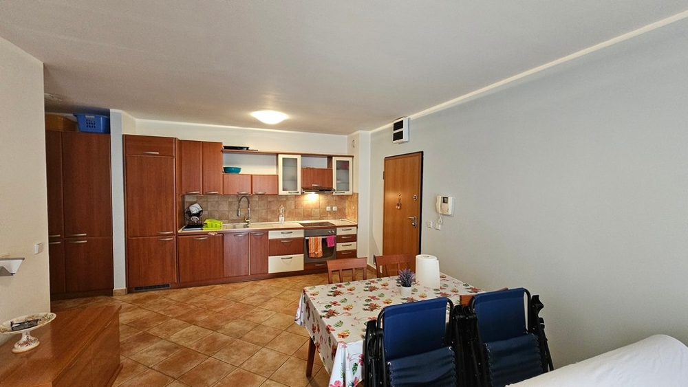 Open kitchen with fitted kitchen and dining area