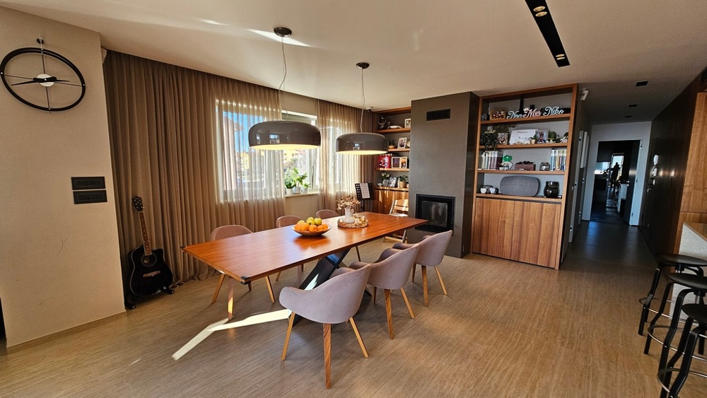 Dining area with fireplace and built-in shelving