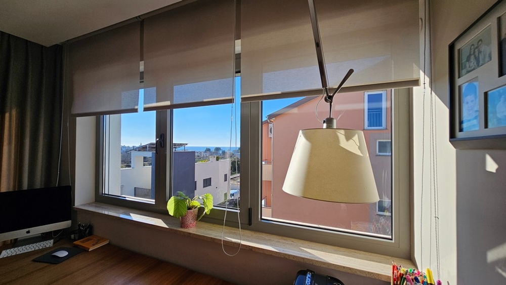 Work area by the window with sea view