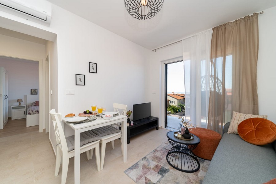 Dining area with access to the balcony and sea views