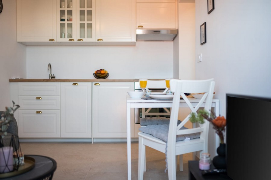 White kitchenette with wooden worktop