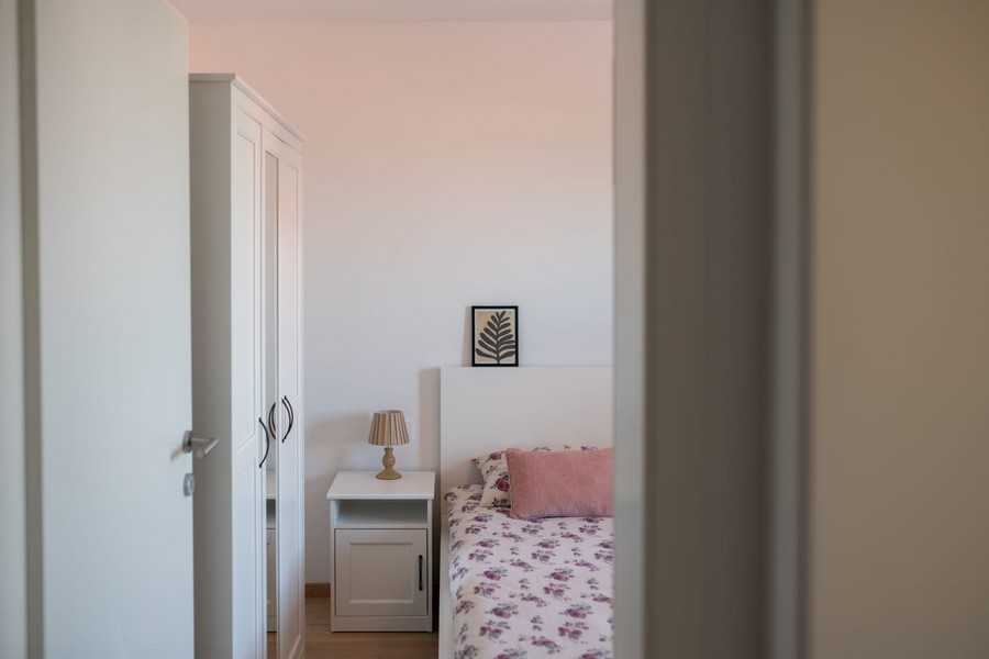 Bedroom with double bed and wardrobe