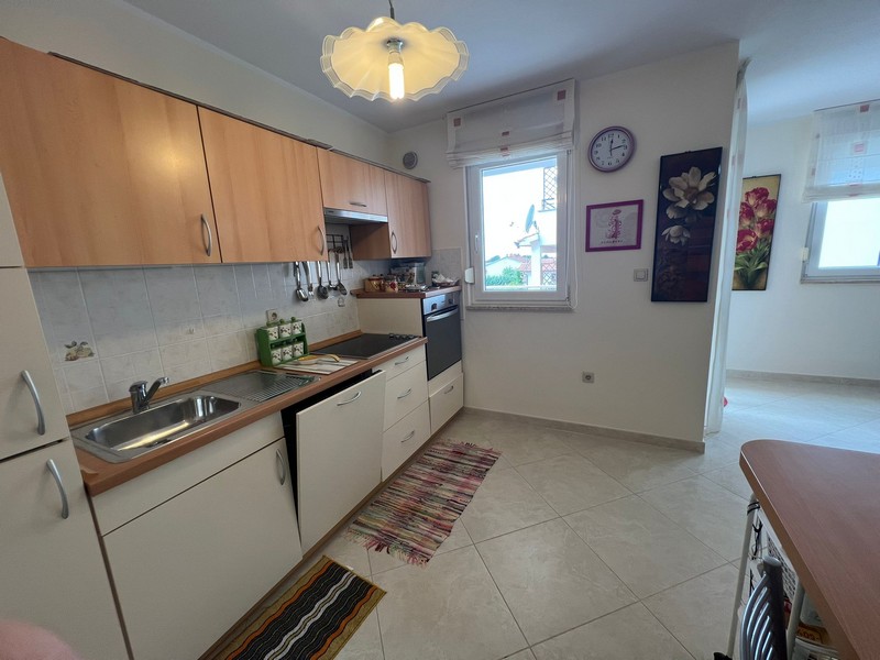 Kitchen with work surface and storage space