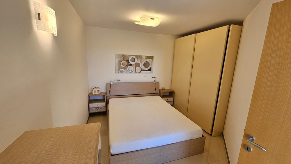 Bedroom with double bed and wardrobe