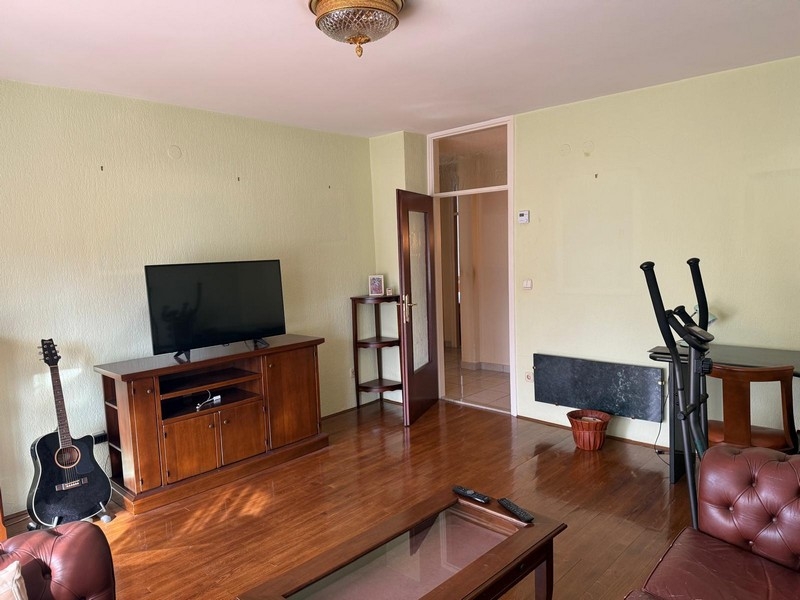 Living area with TV furniture and parquet floors