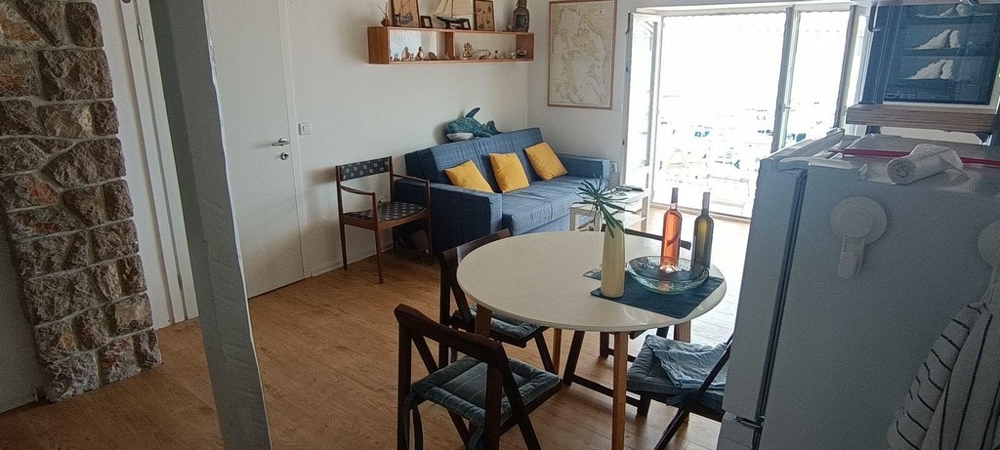 Open living and dining area with views towards the harbor