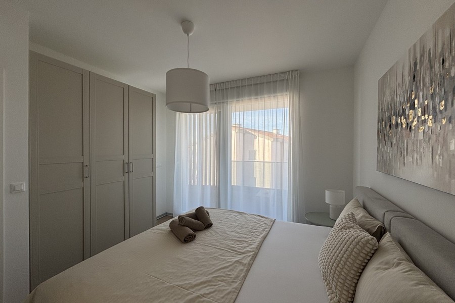 Bedroom with wardrobe and natural light