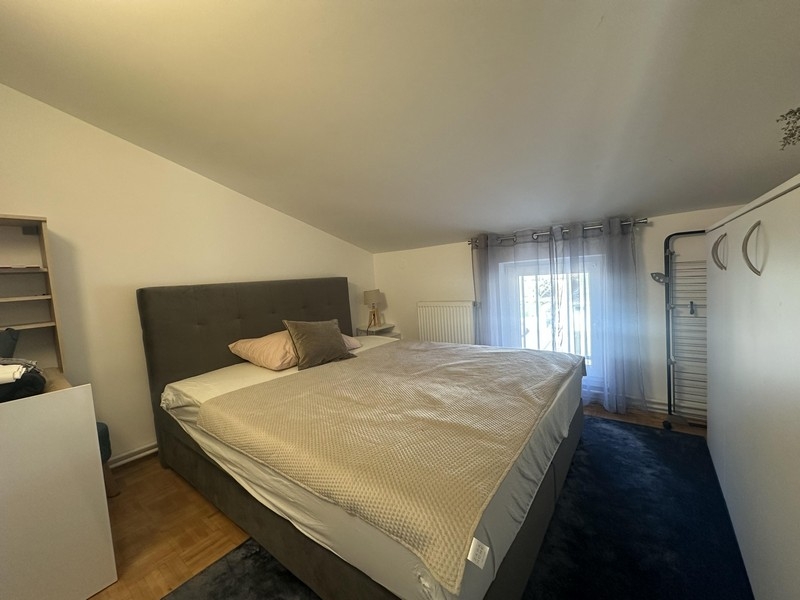 Another bedroom with a double bed in the attic