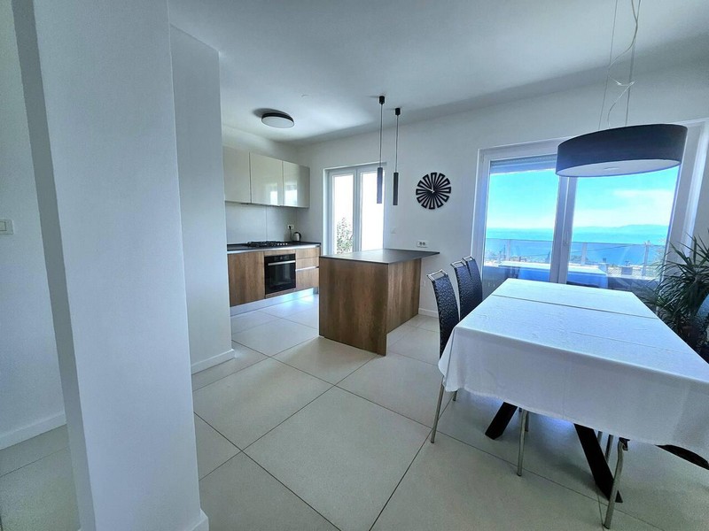 Kitchen and dining table with view of the sea