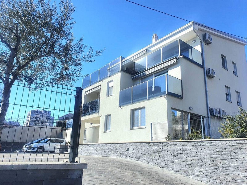 Residential building with glass balconies and access road, Rijeka