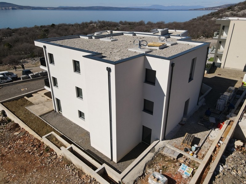 New apartment building with flat roof and modern architecture near the coast
