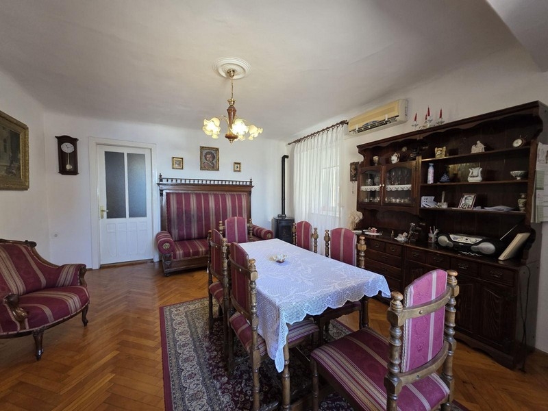 Living room with classic furniture and large dining table