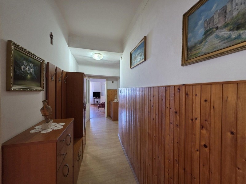 Hallway with wooden paneling and wardrobe