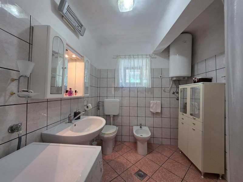 Bathroom with sink, toilet and bidet