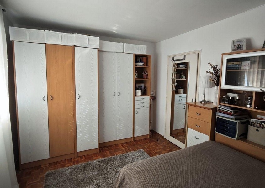Bedroom with large wardrobe and mirror