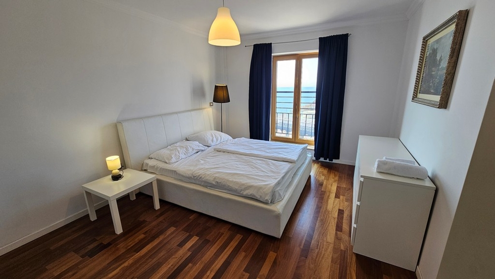 Bedroom with double bed and beautiful sea views