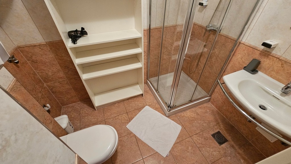 Bathroom with shower, sink and toilet