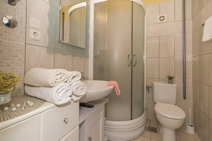 Bathroom with shower and sink