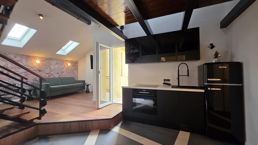 Living area with open kitchen and modern equipment