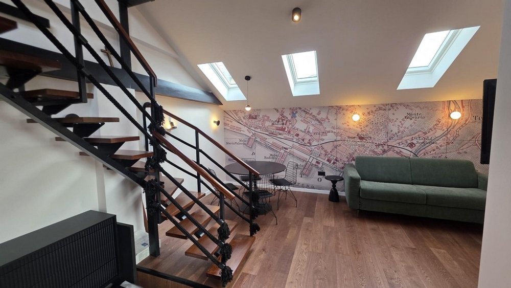 Open living room with gallery and stairs