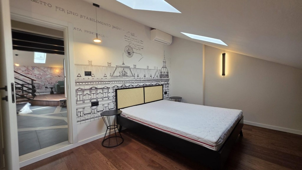 Bedroom with skylights and fitted wardrobes