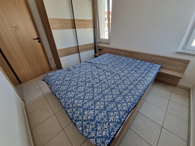 Bedroom with wardrobe and view of the window