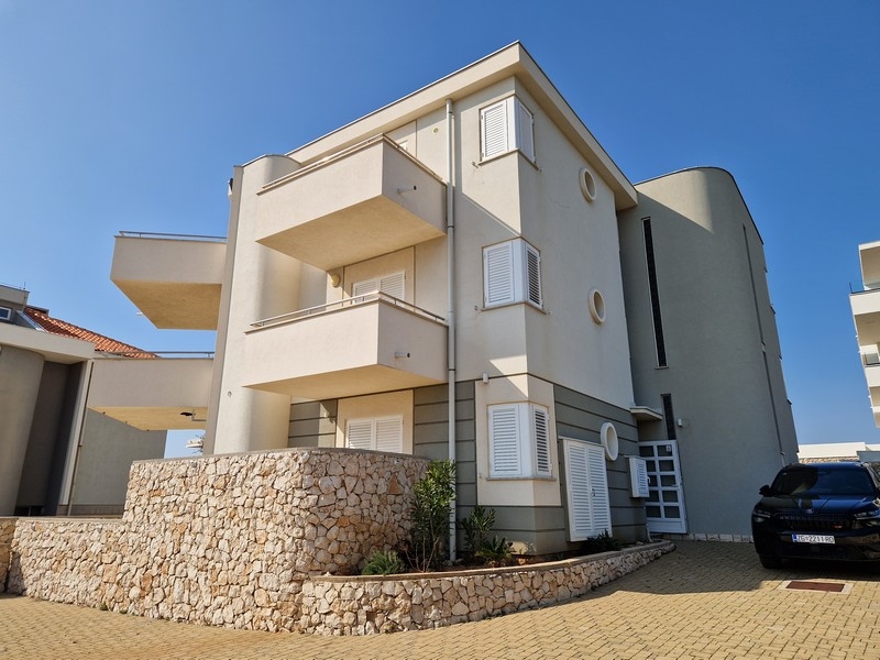 Residential building with parking spaces in front of the house