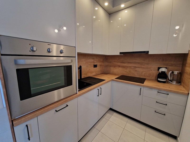 Kitchen with wooden worktop and ceramic hob