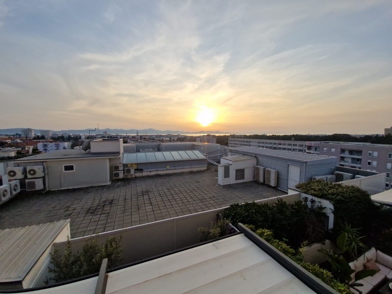 Sea view over the city at sunset