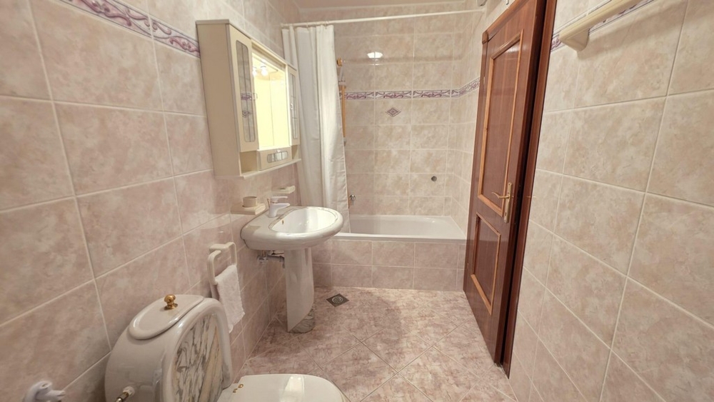 Bathroom with bathtub and sink