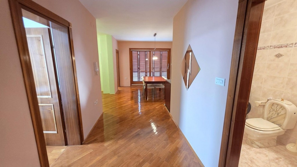 Hallway with access to bathroom and living area