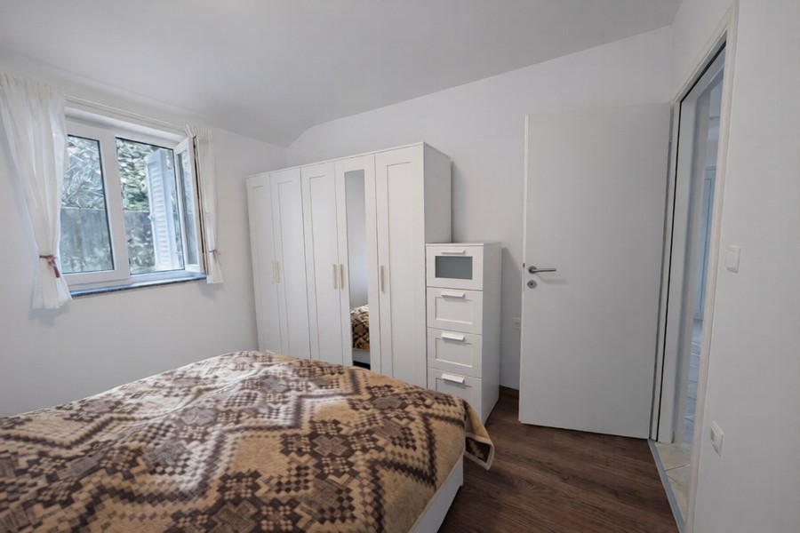 Bedroom with double bed and wardrobe