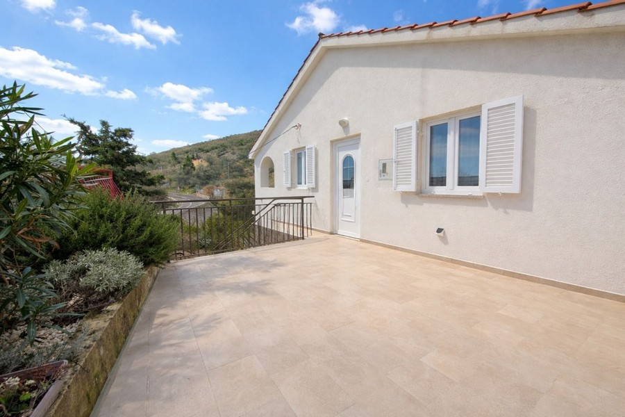 Spacious terrace of the entrance area of ​​apartment A3906 near Senj, Croatia.