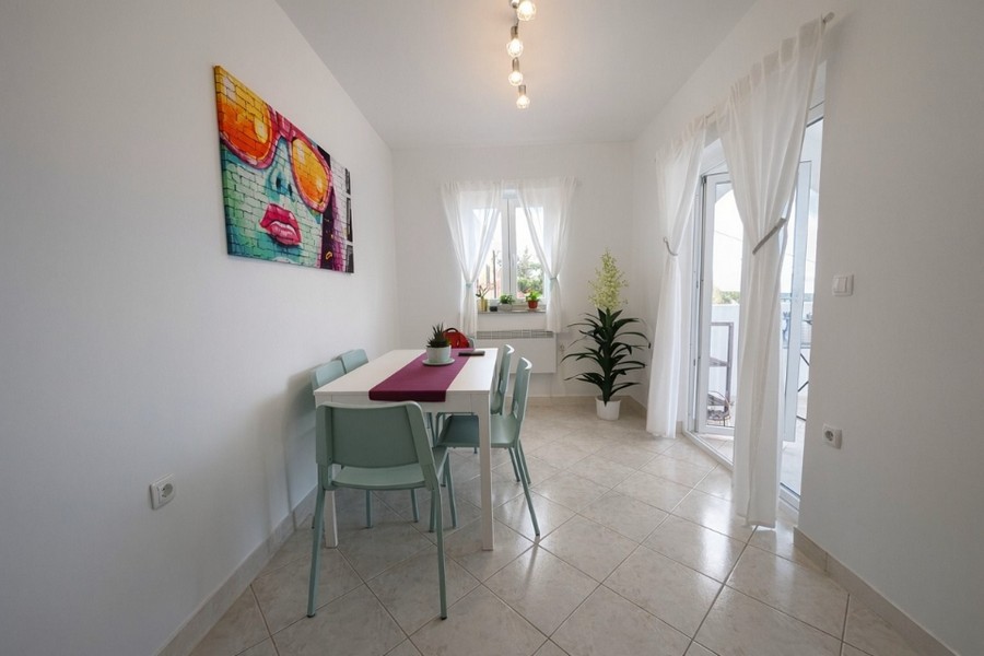 Dining room with balcony access and lots of natural light