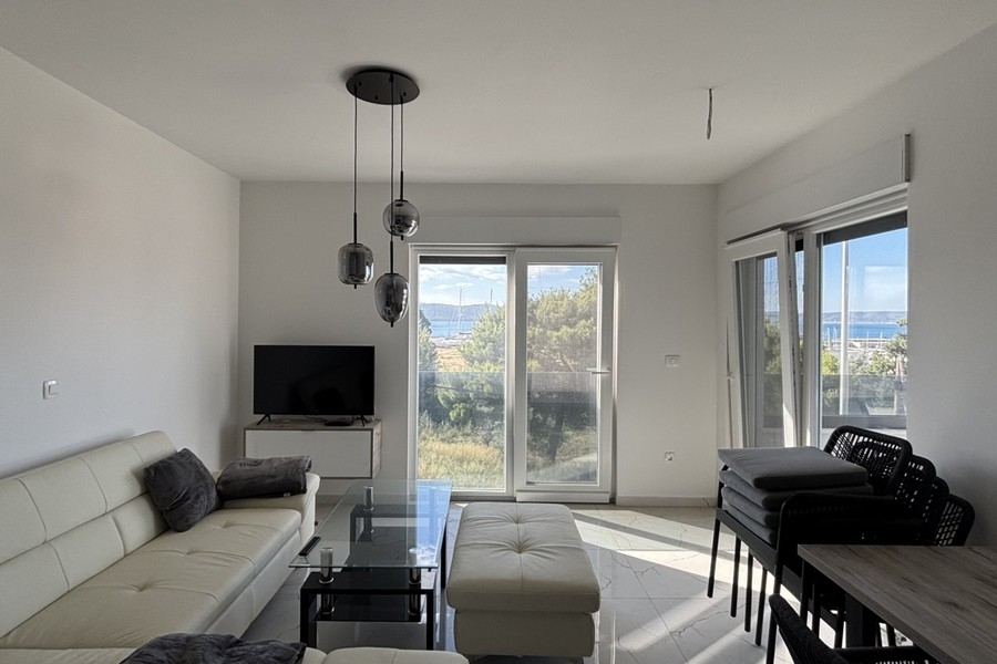 Living room with balcony access and sea view