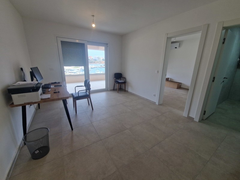 Living area with balcony access and sea views